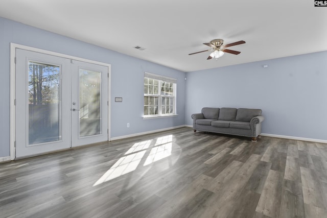 unfurnished room featuring ceiling fan, dark hardwood / wood-style floors, and french doors