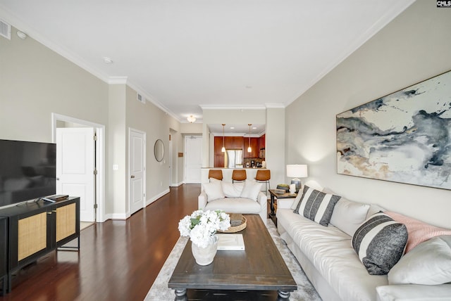 living room with dark hardwood / wood-style floors and crown molding