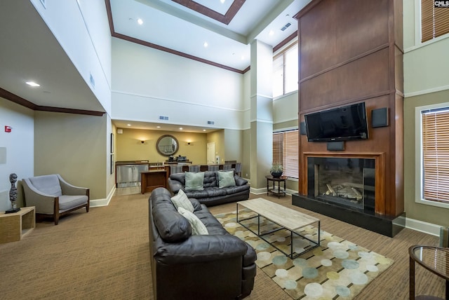 living room with light carpet and a high ceiling