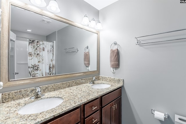 bathroom featuring vanity and a shower with curtain