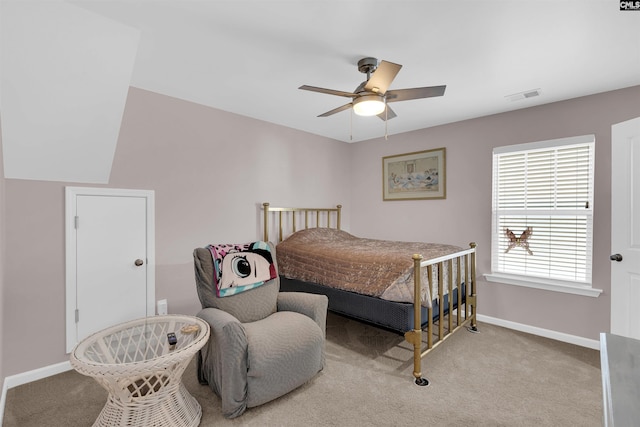 bedroom with ceiling fan and light colored carpet