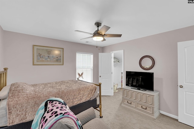 bedroom with ceiling fan and light colored carpet