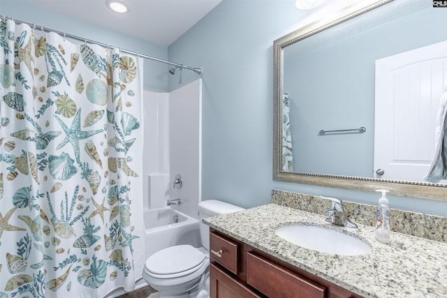 full bathroom featuring toilet, shower / bath combination with curtain, and vanity