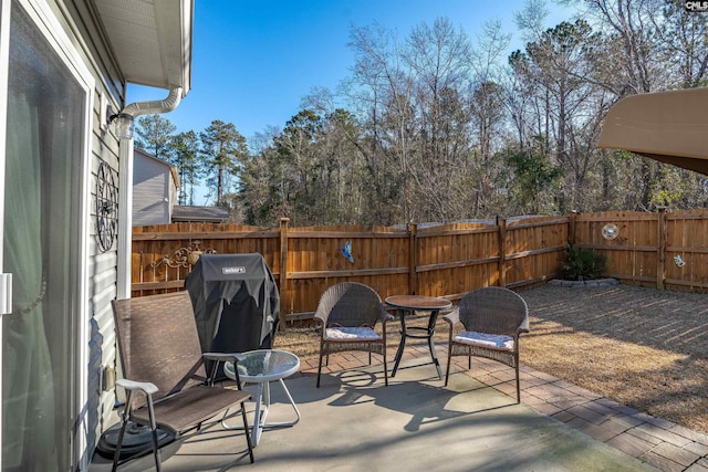 view of patio featuring a grill