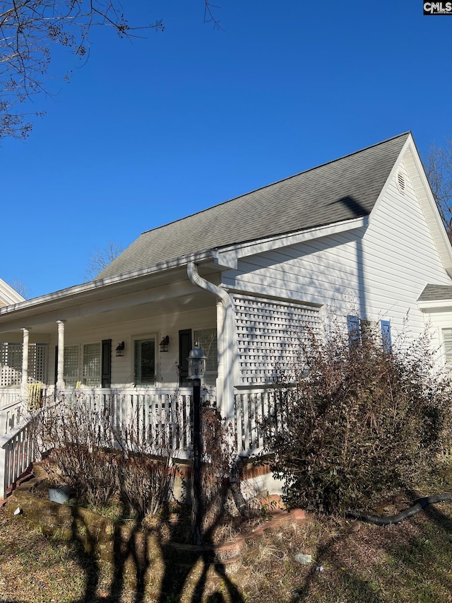 view of home's exterior with covered porch