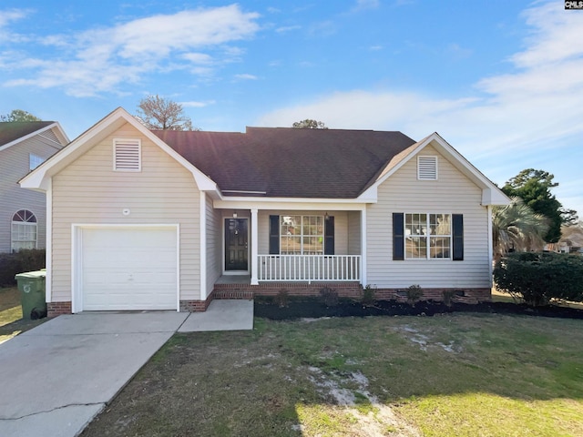 single story home with covered porch, a front lawn, and a garage