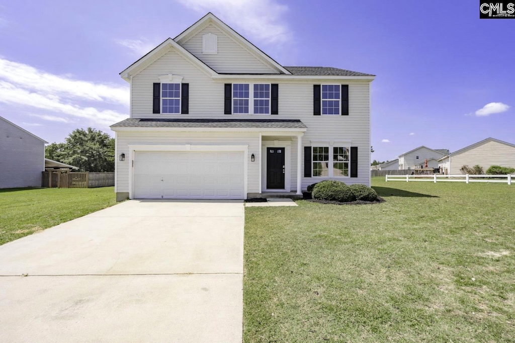 front facade with a front lawn and a garage