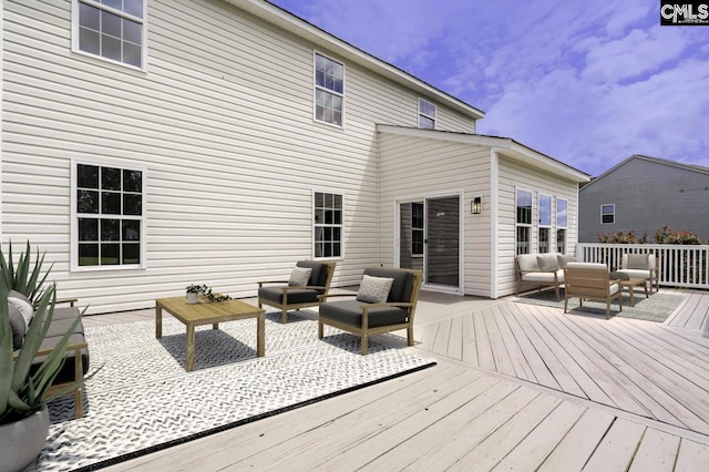 wooden deck with an outdoor hangout area