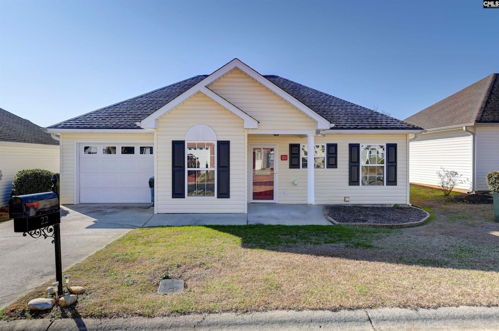 single story home featuring a garage and a front yard