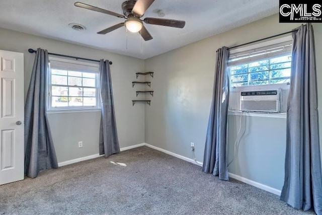 unfurnished room with ceiling fan, cooling unit, and carpet flooring