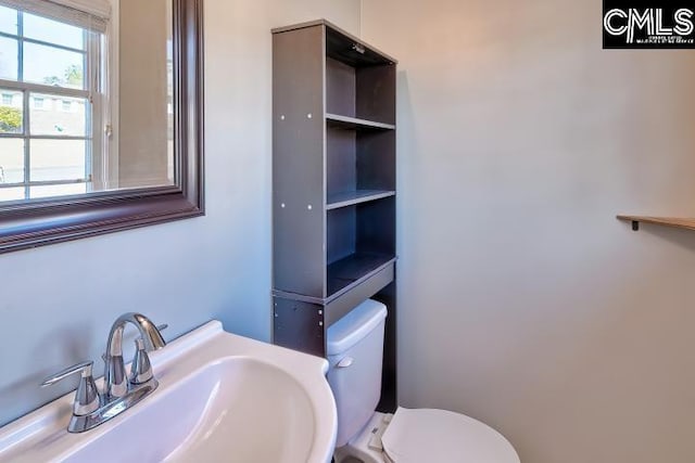 bathroom with toilet and sink