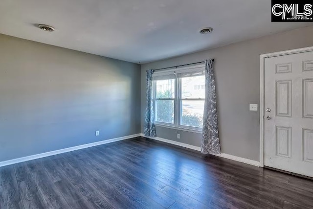 interior space with dark hardwood / wood-style flooring