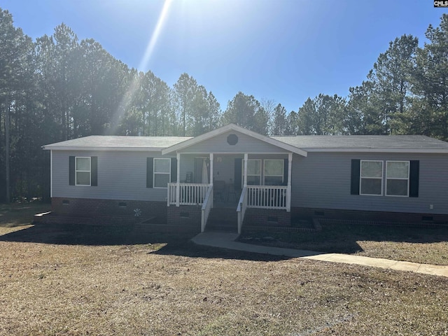 view of front of home with a front lawn and a porch