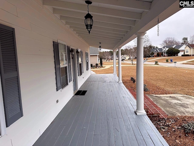 wooden deck featuring covered porch