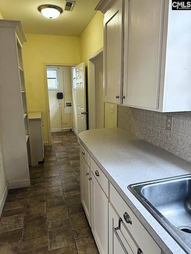 kitchen with tasteful backsplash and sink