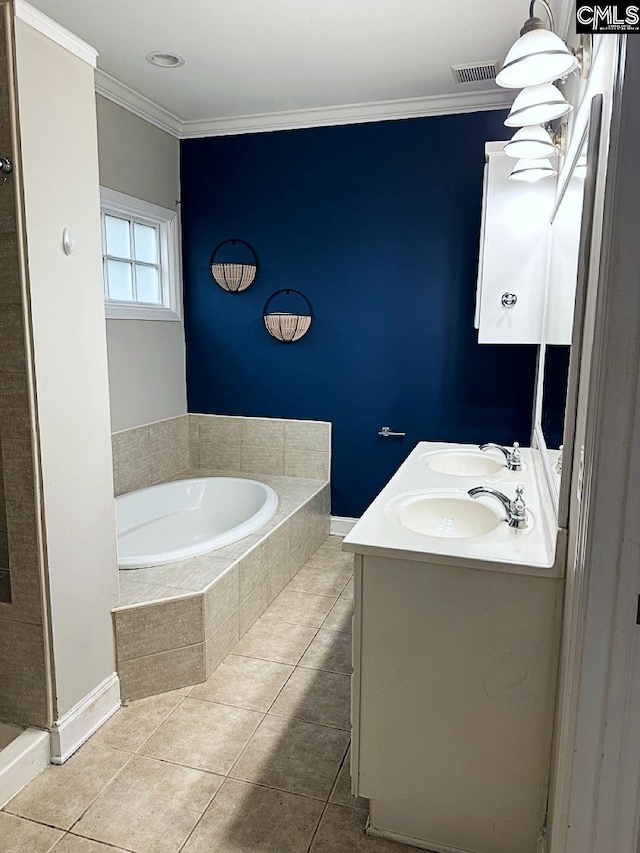 bathroom featuring vanity, tile patterned floors, crown molding, and tiled tub