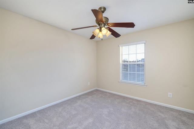 spare room with light carpet and ceiling fan