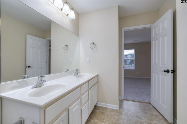 bathroom with tile patterned floors and vanity