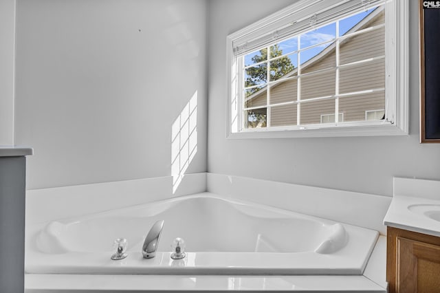 bathroom featuring a bath and vanity