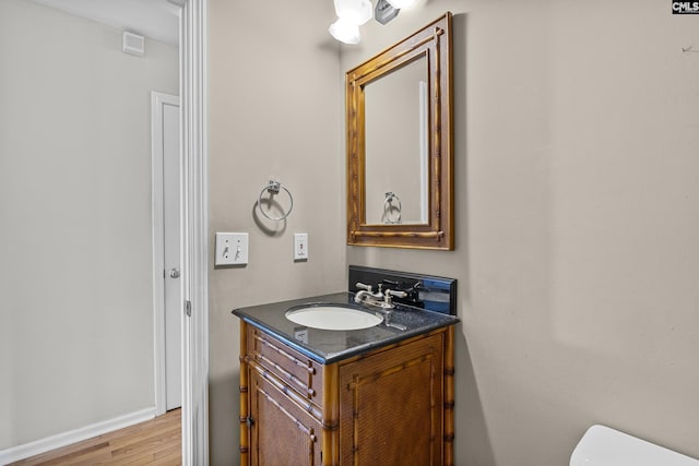 bathroom featuring vanity and hardwood / wood-style flooring