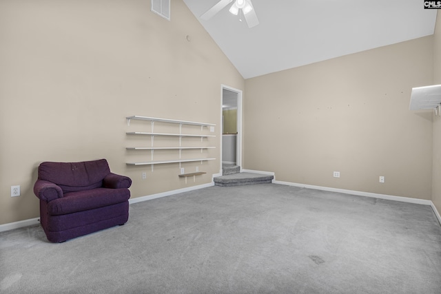 unfurnished room featuring ceiling fan, carpet floors, and high vaulted ceiling