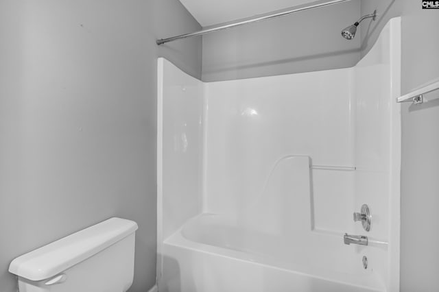 bathroom with toilet and shower / bathing tub combination