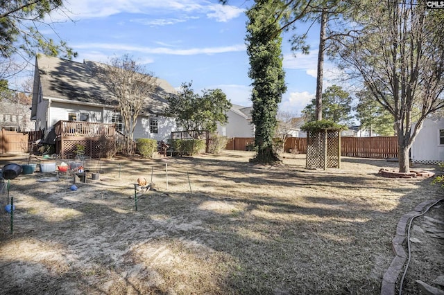 view of yard with a wooden deck