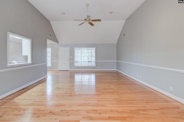 spare room featuring light wood-type flooring, ceiling fan, and lofted ceiling