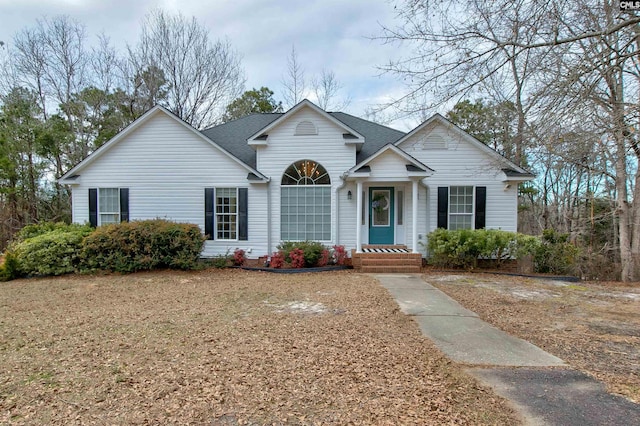 view of front of house featuring a shingled roof