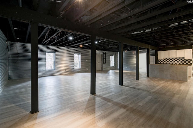 basement featuring light wood-style flooring