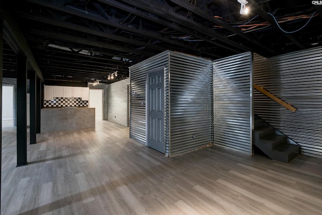 basement featuring wood-type flooring