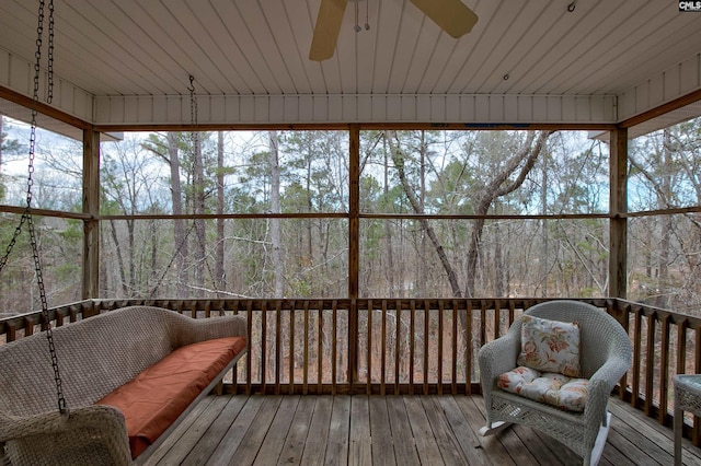 sunroom / solarium with ceiling fan