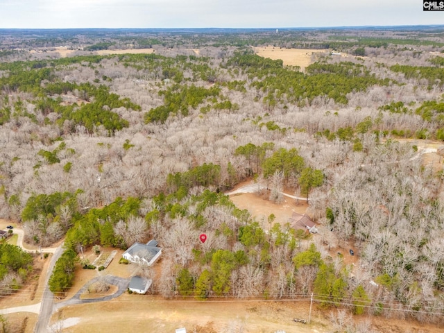 drone / aerial view with a view of trees