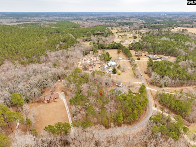 birds eye view of property with a rural view and a view of trees