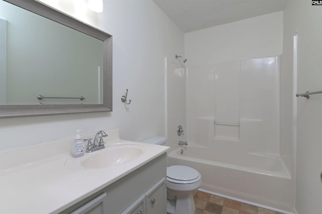 full bathroom with shower / bath combination, a textured ceiling, toilet, and vanity