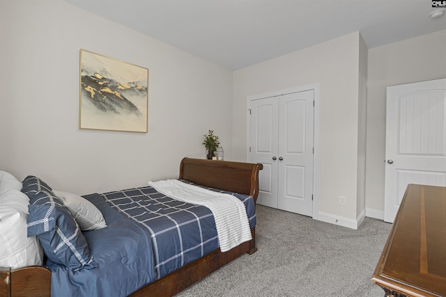 bedroom featuring carpet floors, a closet, and baseboards