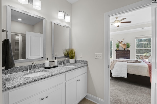 full bathroom featuring ceiling fan, double vanity, ensuite bath, and a sink