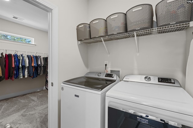 laundry area featuring carpet floors, laundry area, visible vents, and independent washer and dryer