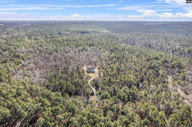 birds eye view of property with a forest view