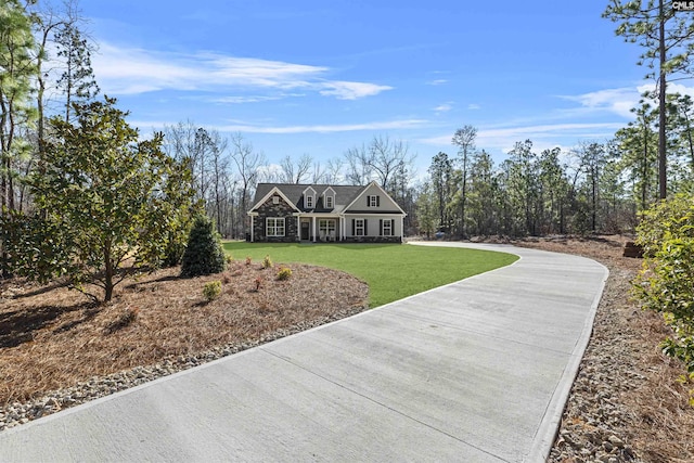 shingle-style home with a front lawn