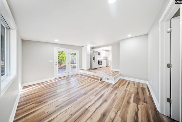 unfurnished living room with light hardwood / wood-style flooring