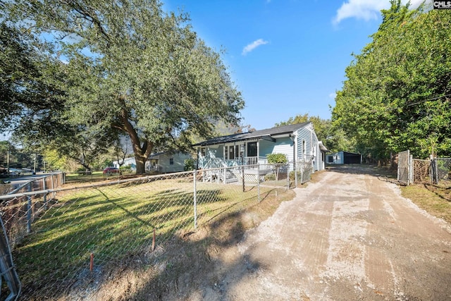 view of front of house featuring a front yard and a porch