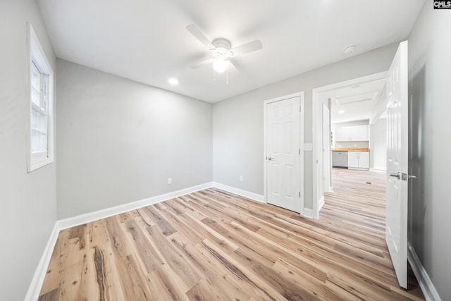 unfurnished room featuring ceiling fan and light hardwood / wood-style floors