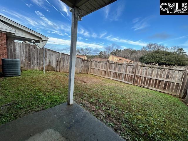 view of yard featuring central air condition unit and a fenced backyard