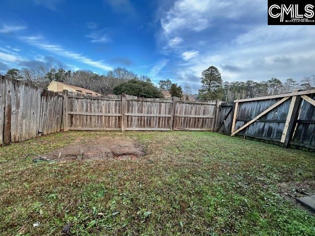 view of yard with a fenced backyard