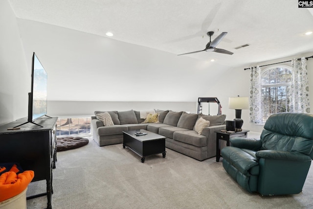 carpeted living room featuring lofted ceiling, a healthy amount of sunlight, and ceiling fan