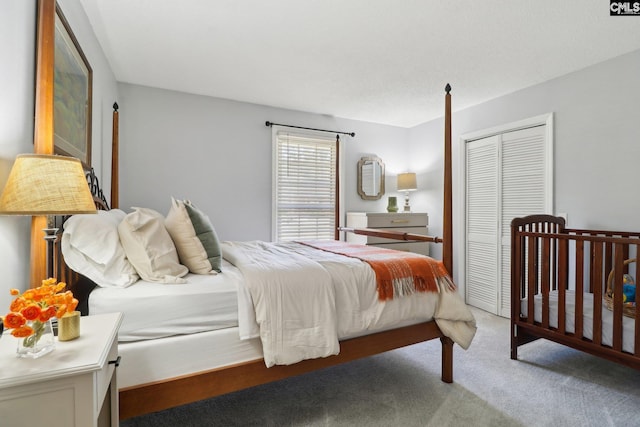 bedroom with light carpet and a closet