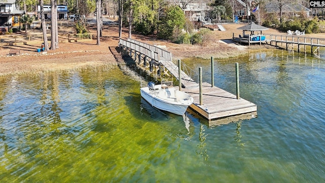 dock area with a gazebo and a water view