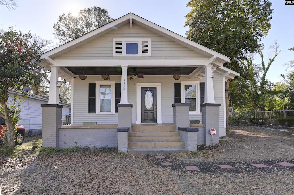 bungalow with ceiling fan and a porch