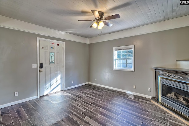 unfurnished living room with ceiling fan, dark hardwood / wood-style floors, and wooden ceiling